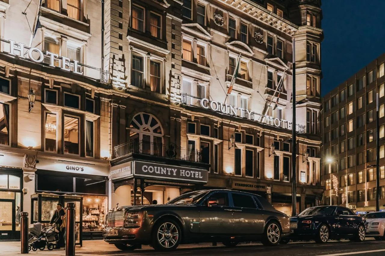 A car parked outside The County Hotel Newcastle in Newcastle city centre