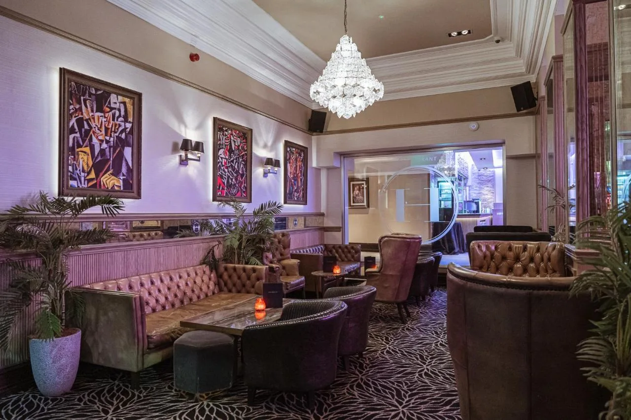 The Hudson Restaurant lounge with chandeliers and comfortable seating at The County Hotel Newcastle